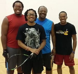 Michael Miller Jr. and sons playing racquetball